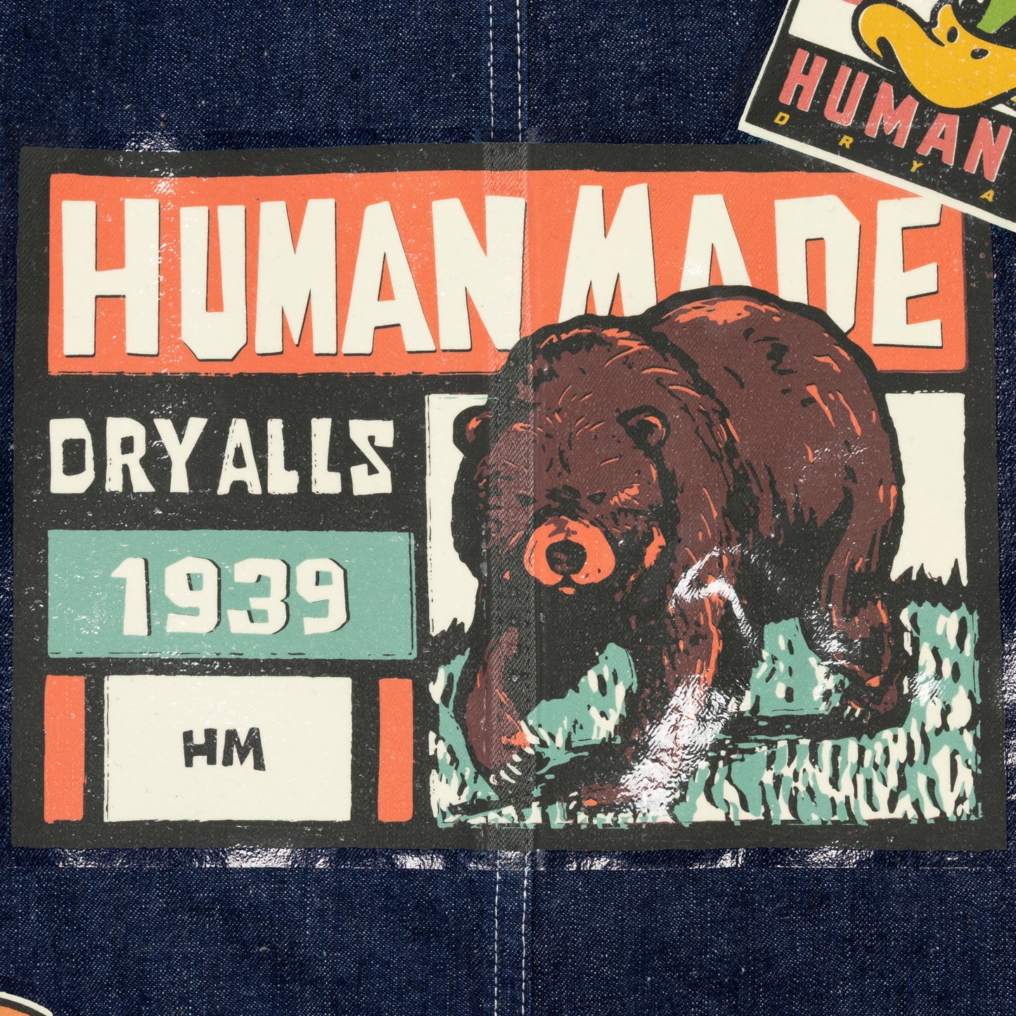 HUMAN MADE SOUVENIR COVERALL JACKET IN-E